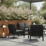 Salon de jardin en métal noir et bac en acier Corten avec graminées dans un jardin contemporain